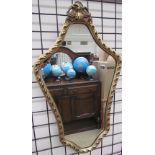 A gilt wall mirror together with two still life paintings and Baxter prints and other pictures,