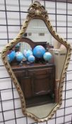 A gilt wall mirror together with two still life paintings and Baxter prints and other pictures,