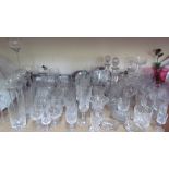 Glass decanters together with a large quantity of drinking glasses, cranberry glass jug,