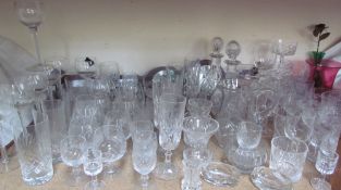 Glass decanters together with a large quantity of drinking glasses, cranberry glass jug,