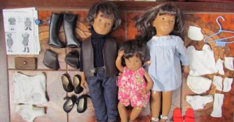 Three Sasha dolls including Gregor in navy sweater and denim trousers,