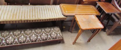 An upholstered duet stool together with an upholstered foot stool a reproduction leather inset