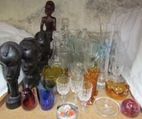 Assorted African carvings together with glass decanters, glass jugs,