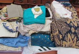 A large collection of linen including blankets, table cloths,