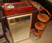 An Edwardian mahogany folding cake stand together with a mirror,