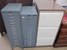 A Bisley three drawer filing cabinet together with two multiple drawer filing cabinets