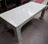 A rectangular coffee table decorated with bone effect panels