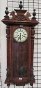 A walnut cased Vienna regulator type wall clock