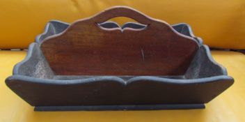 A mahogany two division cutlery tray with a cut out handle