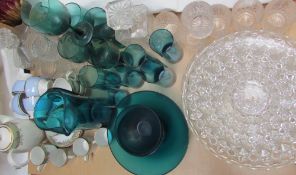 A green glass lemonade set together with decanters and glasses, glass bowls,