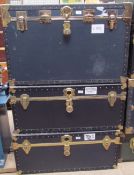 Three brass bound travelling trunks