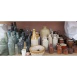 A collection of stoneware bottles,