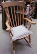 A 20th century slat back rocking chair