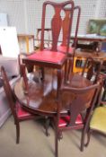 A Victorian mahogany supper table together with a set of six Queen Anne style dining chairs