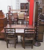 A 19th century oak gate leg dining table of rectangular form with drop flaps on square legs