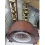 A large pair of brass candlesticks together with a mantle clock