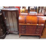 A reproduction mahogany cylinder bureau with three drawers and shaped feet together with a 20th