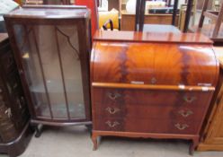 A reproduction mahogany cylinder bureau with three drawers and shaped feet together with a 20th