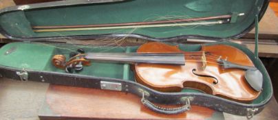 A Violin with a two piece back, bears a label “The Maidstone”, back length including button 37.