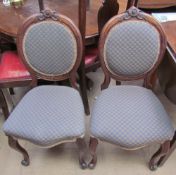 A Pair of Victorian walnut framed dining chairs with upholstered seat and back