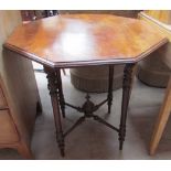 A Victorian walnut occasional table with an octagonal top on four turned legs united by an X