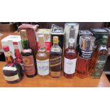A Tomintoul Glenlivet perfume bottle whisky together with four other whisky bottles,