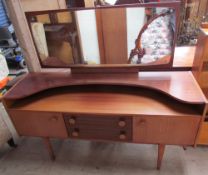 A Castle teak dressing table together with a matching wardrobe