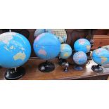 A miniature gem set globe together with six other globes