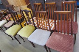 A set of five mid-20th century teak dining chairs together with a pair of bedroom chairs,