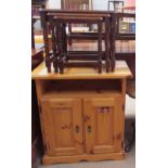 A nest of three oak tables together with a pine side cabinet,