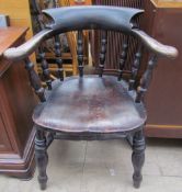 A smoker's bow elbow chair CONDITION REPORT: In well used condition - thick black