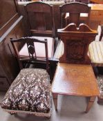 A Victorian oak hall chair with a blind fretwork decorated back together with an Edwardian nursing