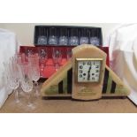 An Art Deco style mantle clock together with boxed and loose crystal drinking glasses