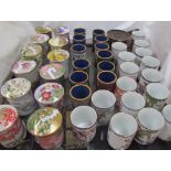 Japanese floral decorated porcelain beakers together with Japanese cups and covers and a collection