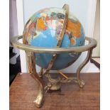 A gem set globe, with countries and continents depicted in abalone shell,