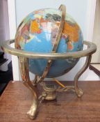 A gem set globe, with countries and continents depicted in abalone shell,