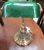 A green glass and brass desk light