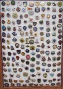 A framed display of bowls and bowling pin badges