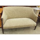 An Edwardian mahogany upholstered two seater settee