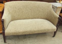 An Edwardian mahogany upholstered two seater settee