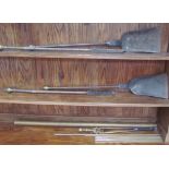 19th century brass and cast iron fire irons including two shovels and two pokers,