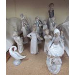 Assorted Lladro and Nao figures of children,