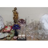 An oriental resin figure together with onyx lighters, drinking glasses, water jug,