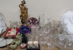 An oriental resin figure together with onyx lighters, drinking glasses, water jug,