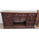 A late 19th century oak dresser base, the rectangular top above a central drawers,