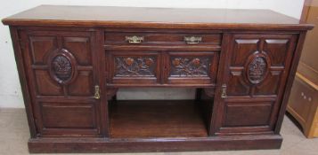 A late 19th century oak dresser base, the rectangular top above a central drawers,