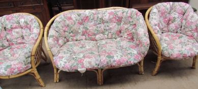 A floral upholstered three piece conservatory suite