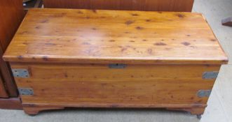 A 20th century pine coffer on casters