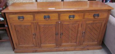 A 20th century hardwood sideboard with lattice effect front