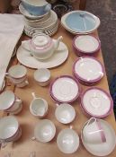 A Czechoslovakian purple lustre part dinner set together with another part dinner set